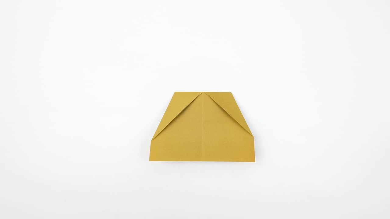 Fold the entire model in half along the original center crease, bringing the right half behind the left.