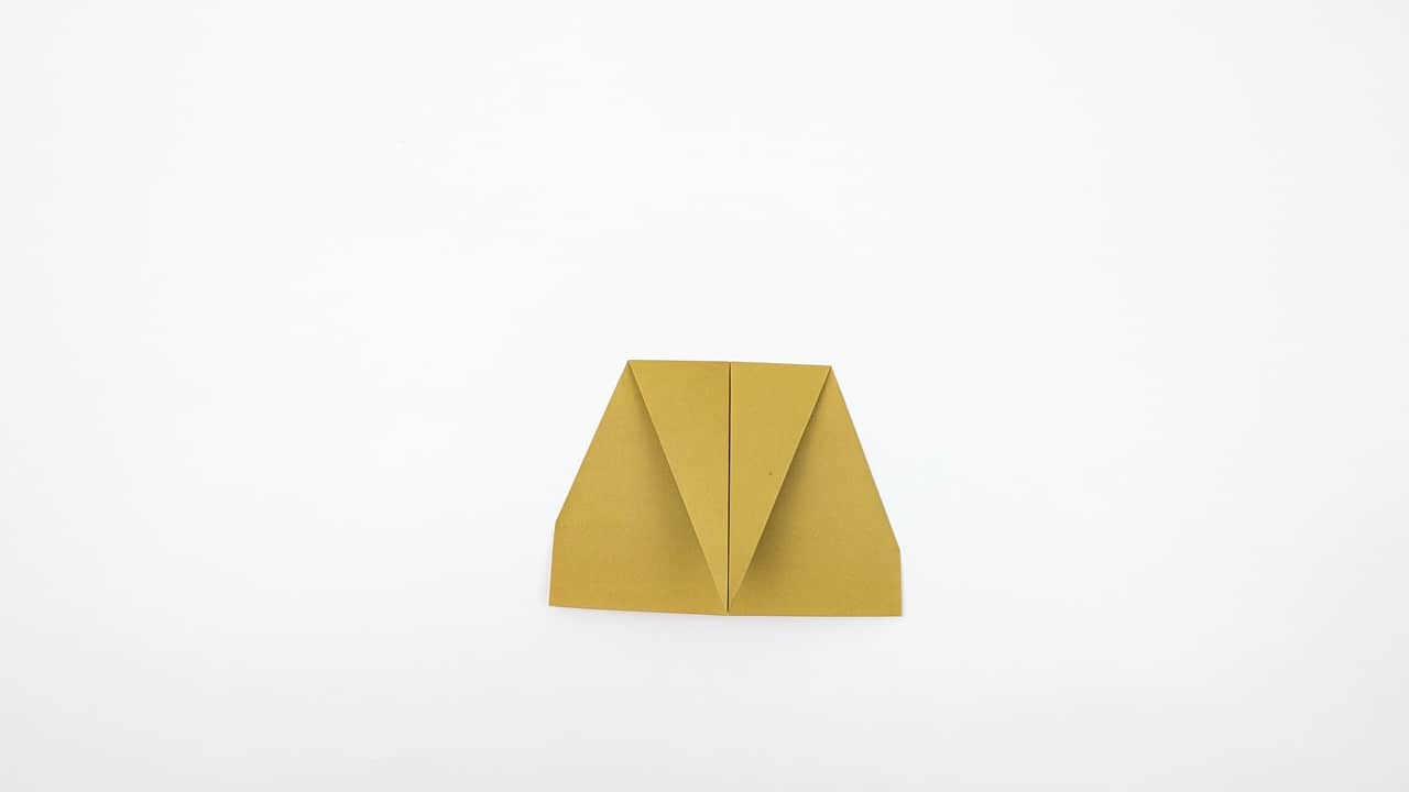 Crease both second folds firmly. The nose should be a tight, sharp point.