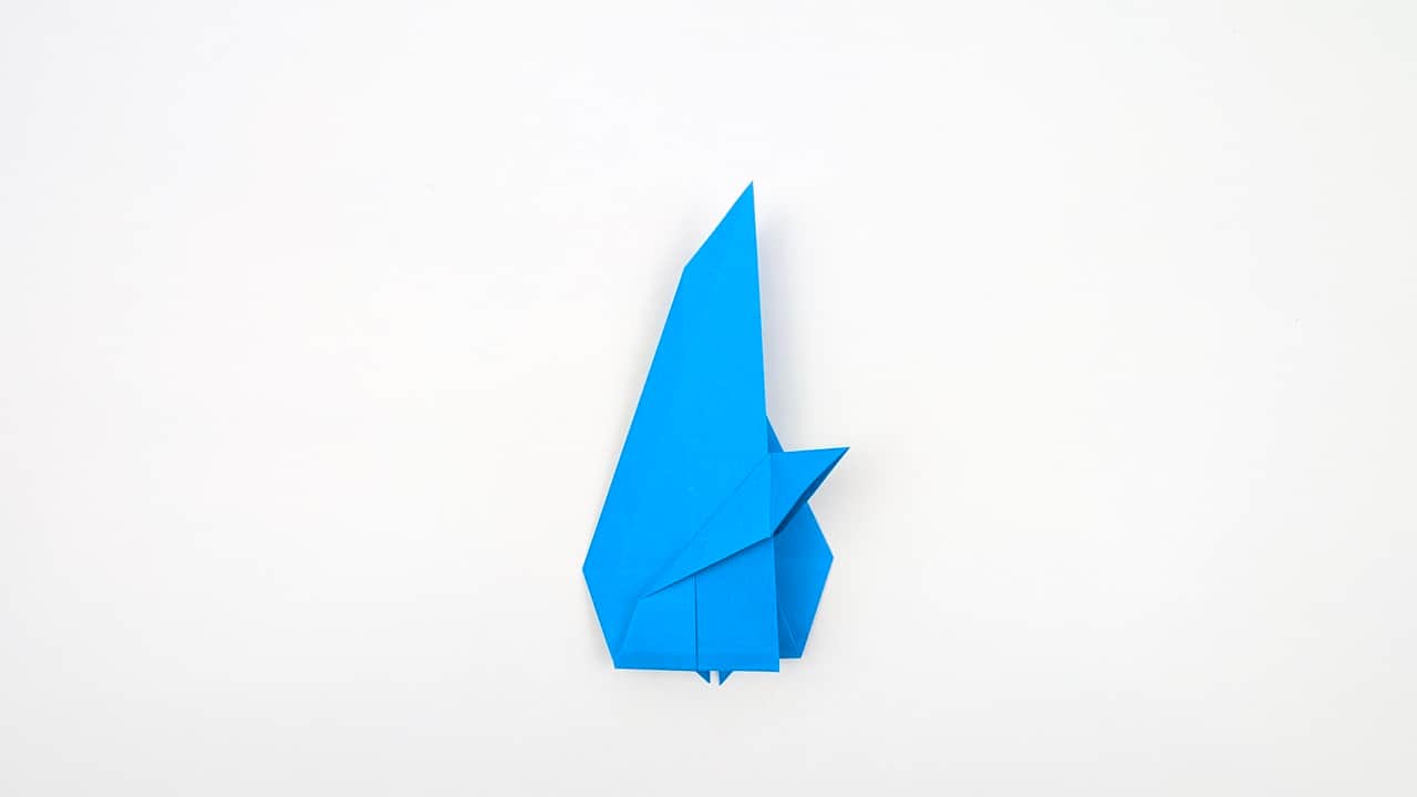 Reverse-fold the dorsal fin upward so it stands above the body.