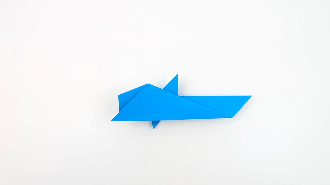 Turn the model sideways. Fold the top layer of the body in half lengthwise to give it dimension.