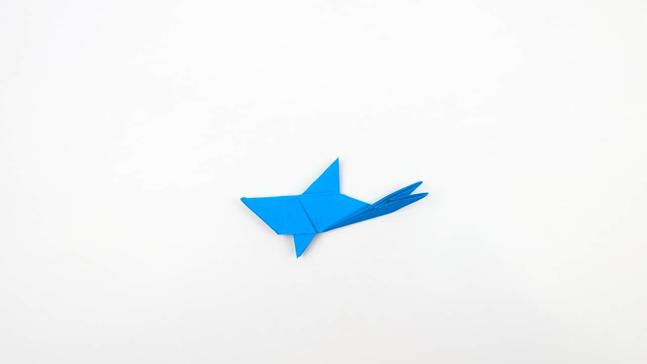 Make any final adjustments to the nose — it should be pointed and slightly curved downward.