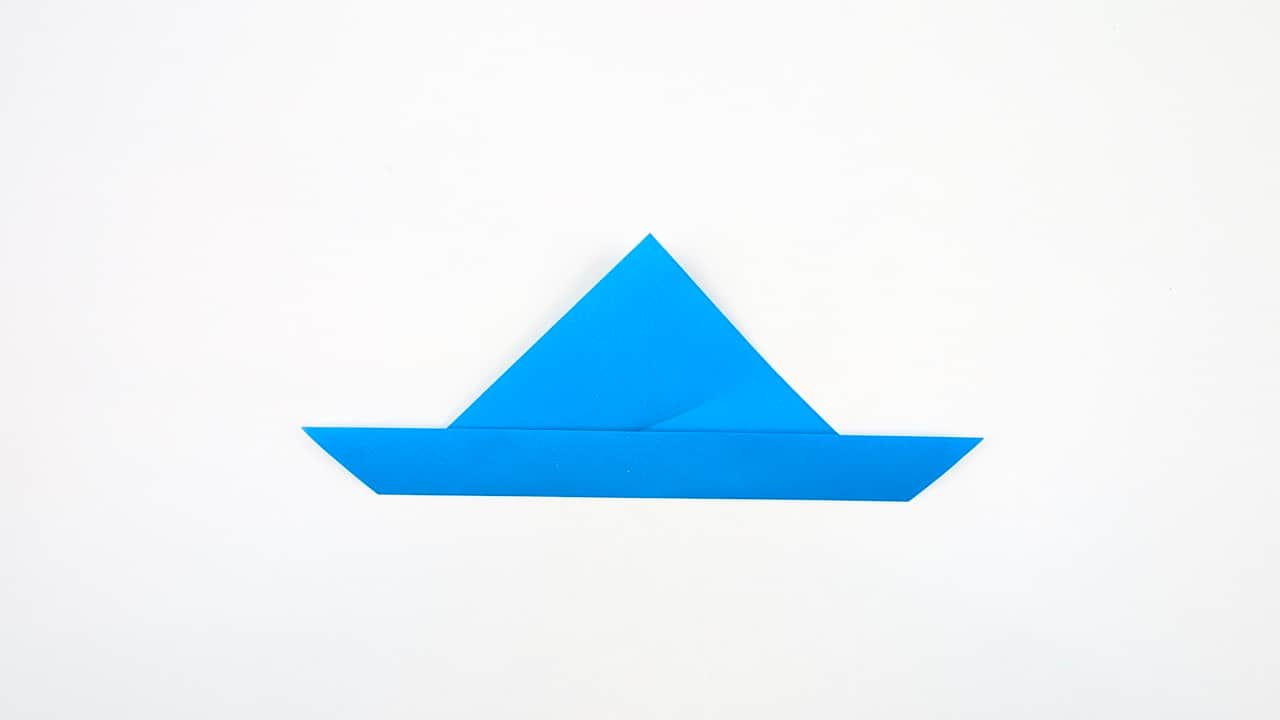 Fold the right front flap to the left along the center crease.