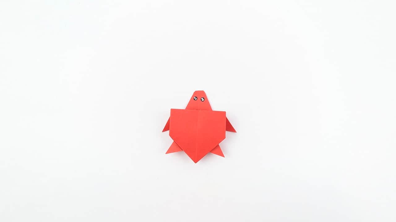 Your origami turtle is complete. It sits stably and the shell dome gives it a realistic three-dimensional look.